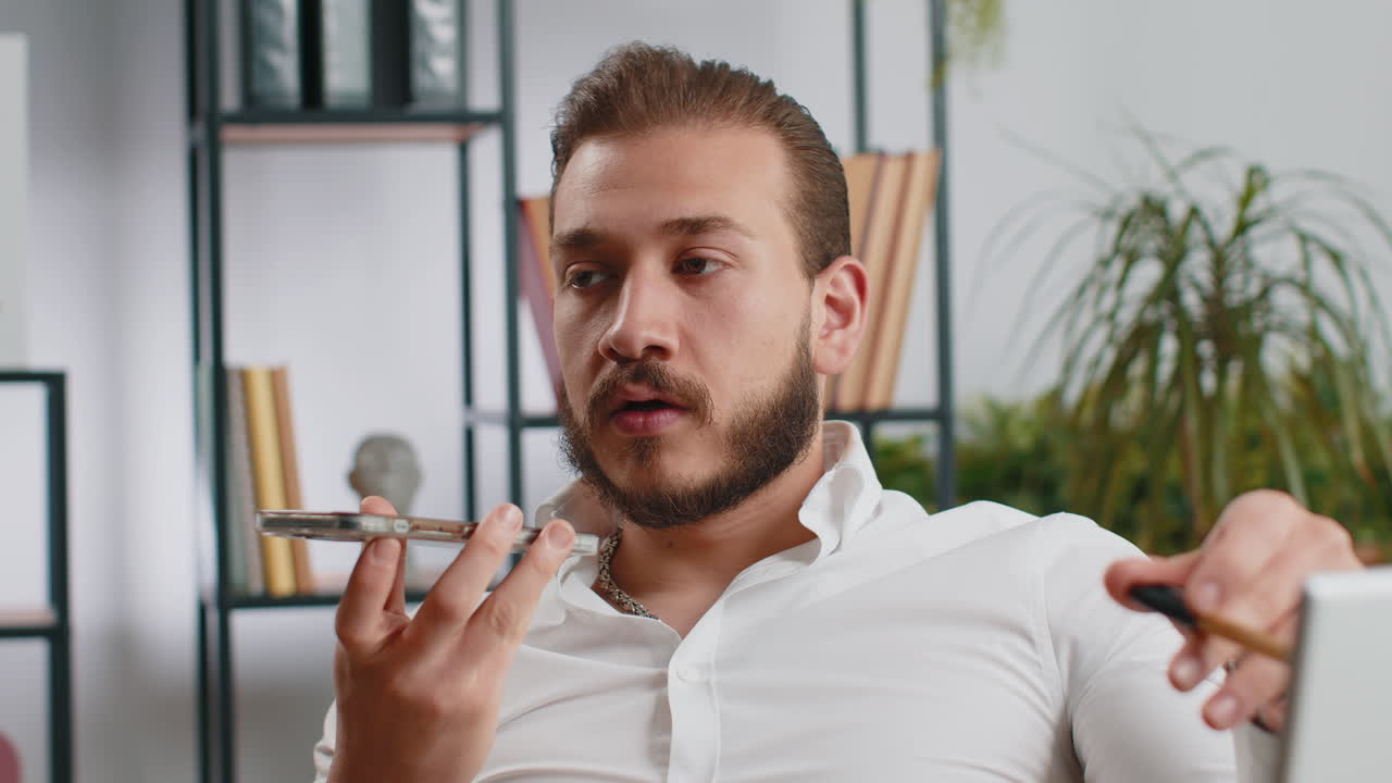 Lebanese business man working having mobile phone talk at office workplace using messenger chat apps