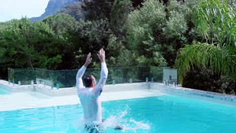 Businessman-jumping-in-the-swimming-pool