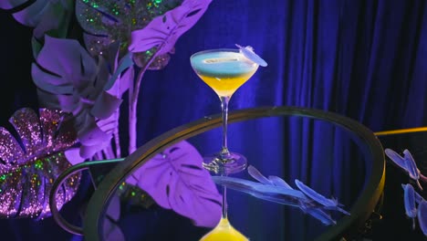 vibrant cocktail with feathers and neon decor