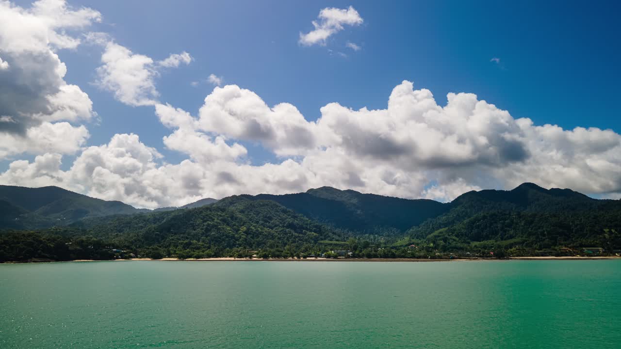 4K  Hyper-lapse View of jungle Mountainous Hillside on Tropical Summers Day on  Island with clouds moving fast