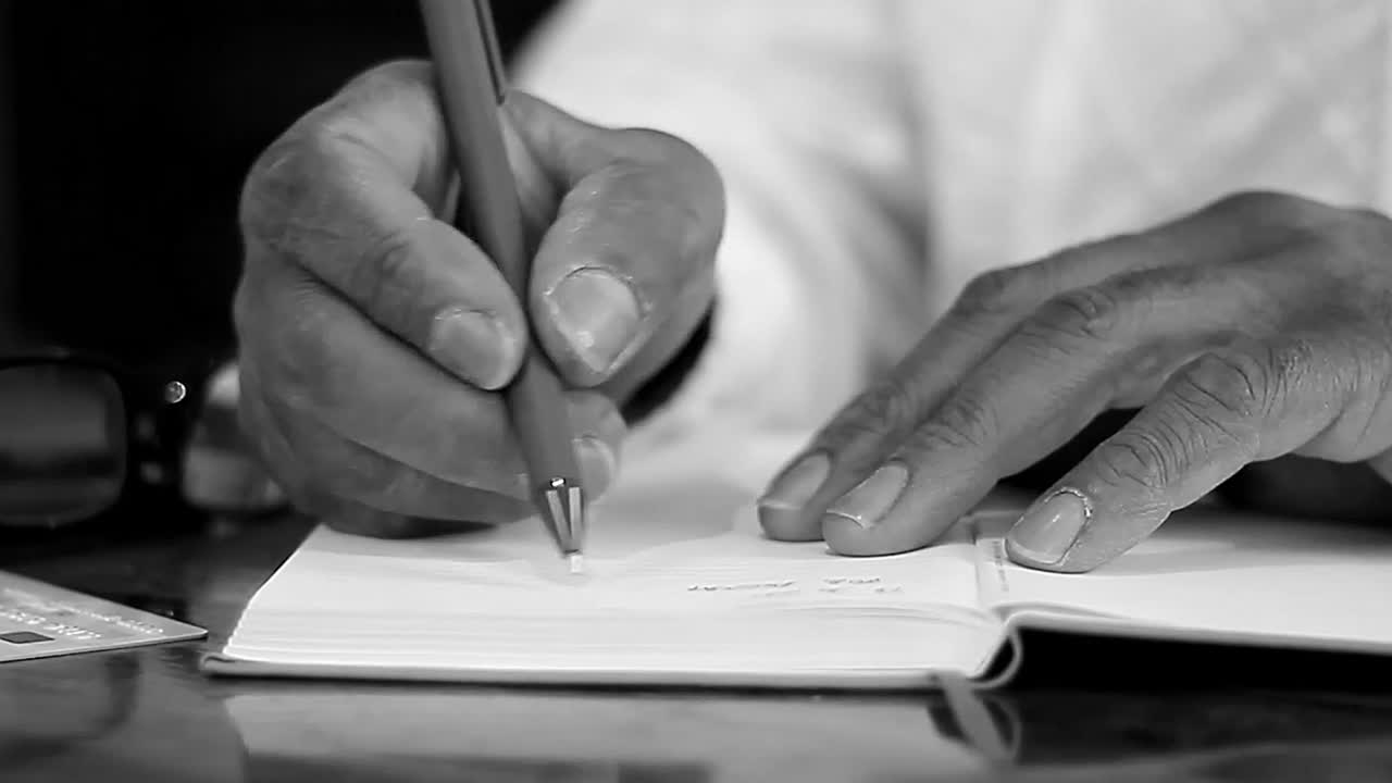 writing on paper with pen in the office legally binding contract sign stock footage stock video