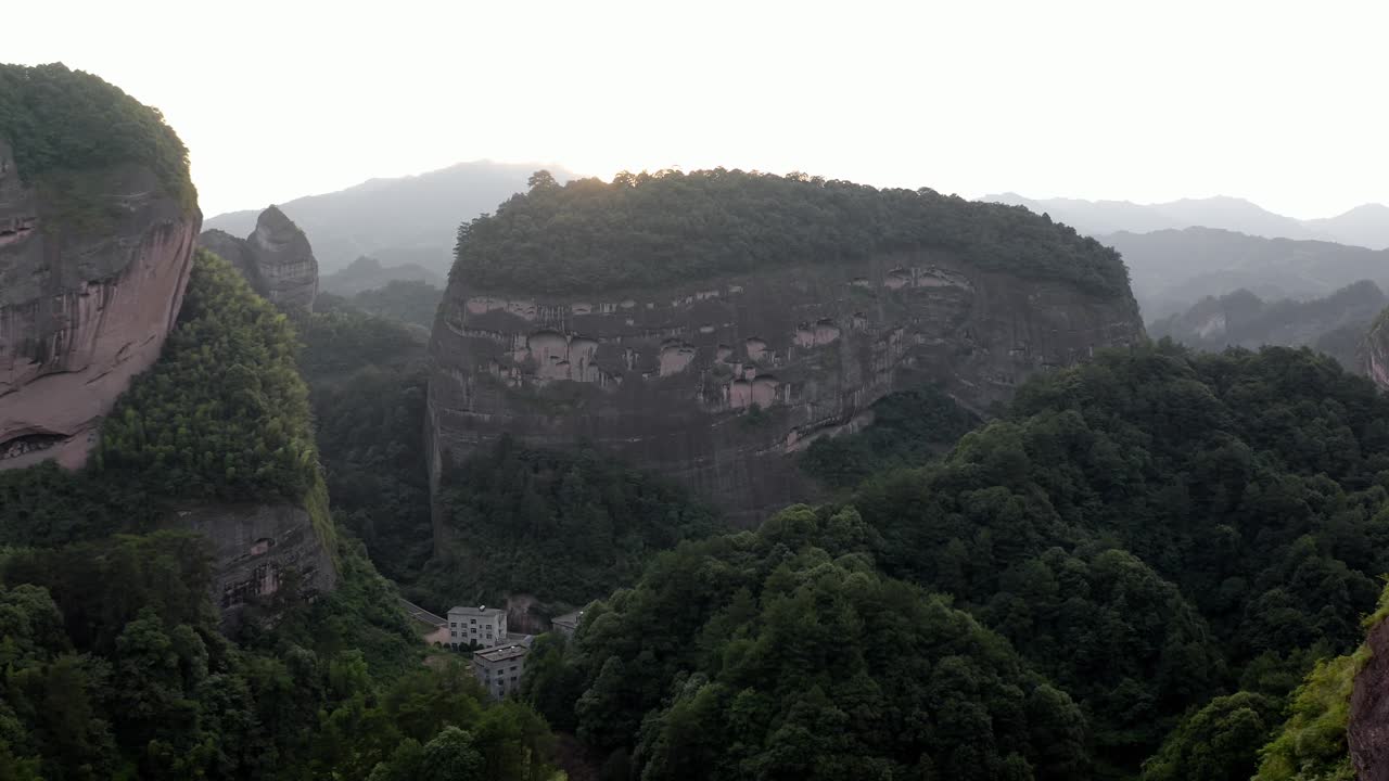 Aerial: Bajiaozhai shan mountain in Ziyuan, Hunan, China at sunset