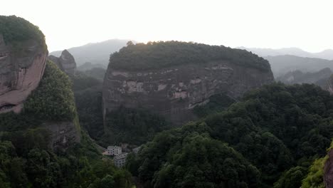aerial: bajiaozhai shan mountain in ziyuan, hunan, china at sunset