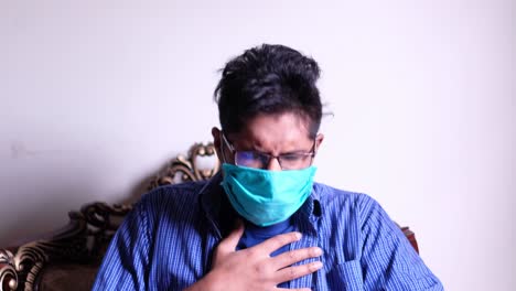 man experiencing illness while wearing a mask