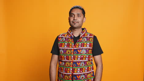 person in traditional attire feeling carefree, studio background