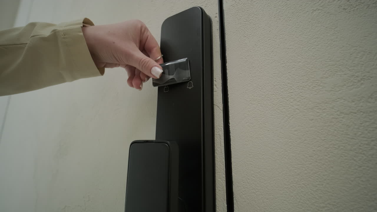 Woman Unlocks Modern Digital Door Lock with Key Card
