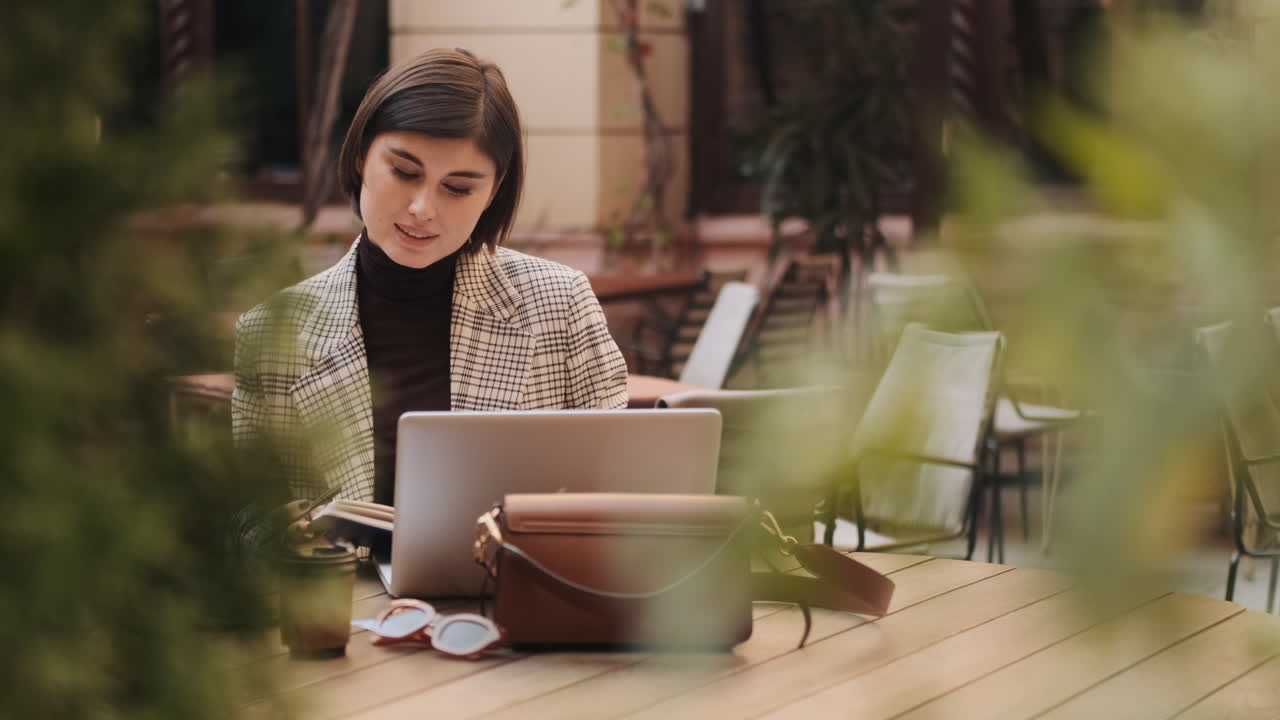 Young businesswoman working outdoor.