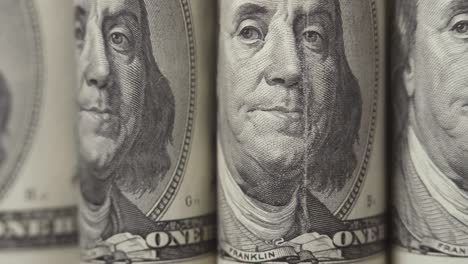 american dollars. portraits of franklin on one hundred dollar bills are moving in the frame. cash. money background. close-up