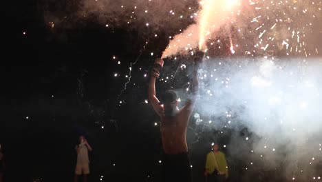 fire dancer with fireworks