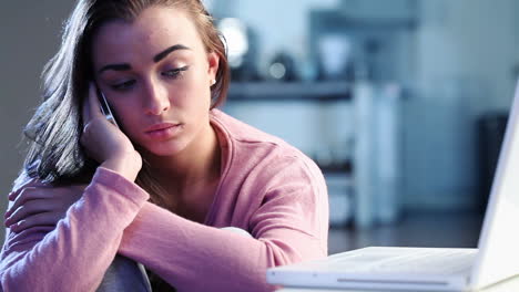 Sad-depressed-teenage-girl-using-cell-phone