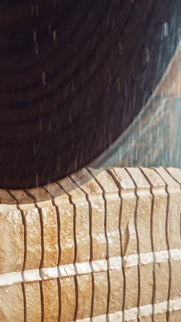 circular saw for cutting. close up of worker use wet sawing machine for cutting marble stone vertical video