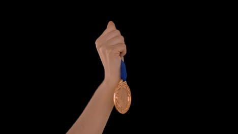 hands throwing a medal