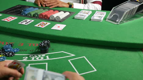 buying poker chips in a casino at a black jack table with stacks of cash