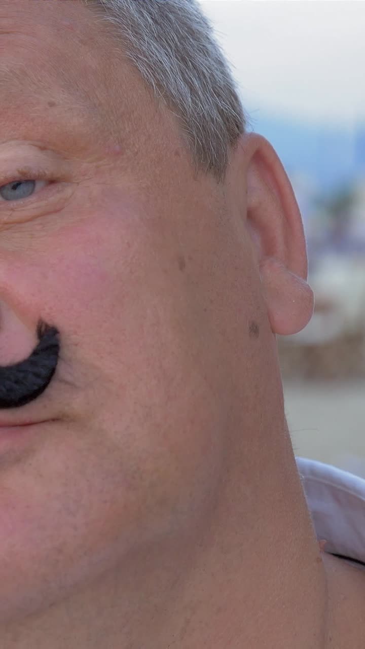 Man with fake mustache