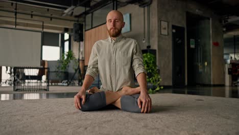 man meditating in an office