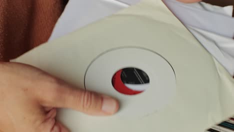 man hands browsing vintage vinyl records at shop close-up. searching music. musical shopping. retro vinyl record player. high quality 4k footage
