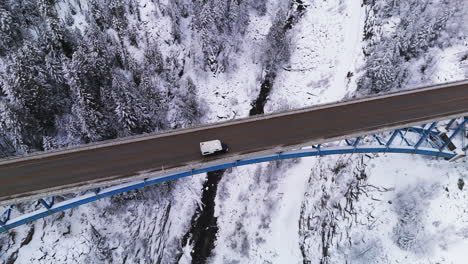 kootenay majesty: aerial view of paulson bridge in snowy wonderland