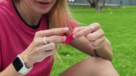 woman beading in a park