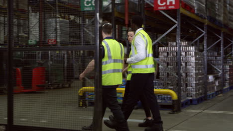 staff walking though warehouse with manager, shot on r3d