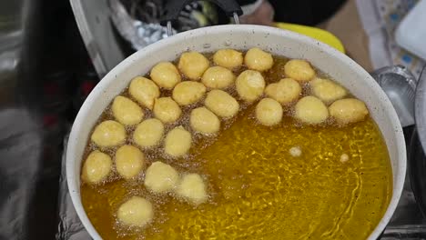 luqaimat balls, the most popular emirati desserts, are being prepared