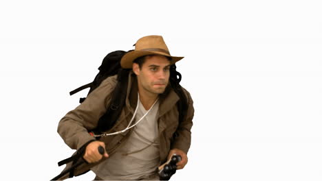 man orienteering while holding a hiking stick on white screen