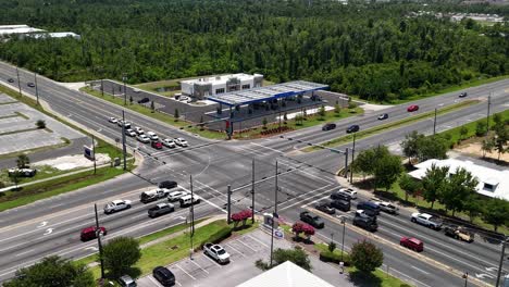 cars on the intersection road following traffic rule with buildings nearby in panama city, florida