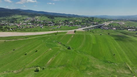 building new road and modern viaduct through countryside in poland, aerial view