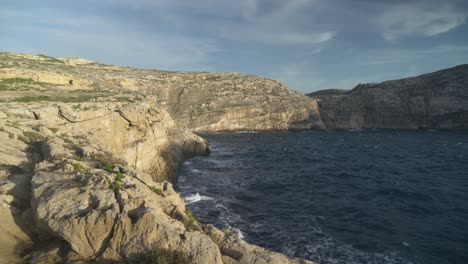 raging mediterranean sea waves crashes on shores near azure window in gozo, malta