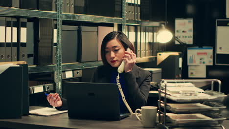 private agent calls forensic experts on landline phone in archive