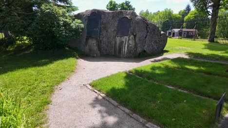 Walking-into-the-enclosure-of-John-Brown’s-Grave-In-North-Elba,-New-York