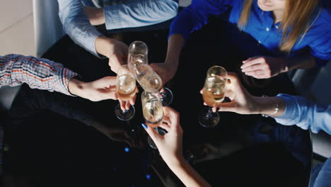 a group of young people have fun at a table in the club 9