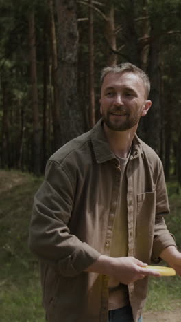 man smiles in the forest