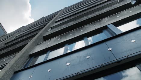 push-out shot starting from worm's-eye view to reveal aged social housing in nieuw gent, ghent, belgium
