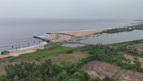 aerial view of coastal landscape with fishing boats and estuary