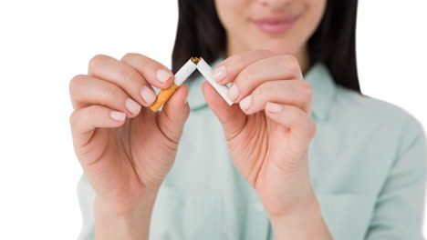 animation of caucasian woman breaking cigarette over retro explosion bubble on white background