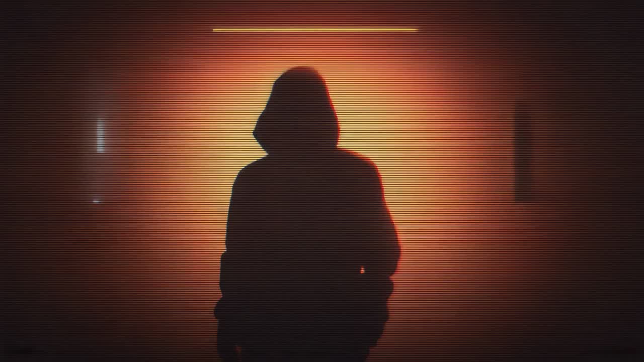 Under horizontal lamp hooded figure displaying sliding glitch bar scanlines and band over backlight