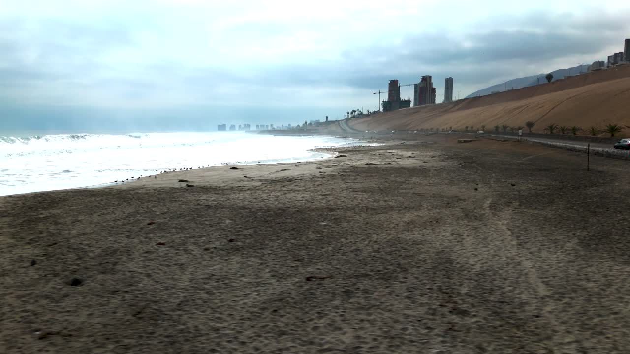 Huayquique beach Chile Iquique building ocean sea traffic tarapaca mountain side travelling drone