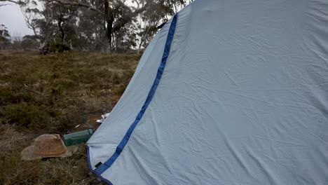 rain falling on a tent while pitched in the mountains of australia in stormy weather