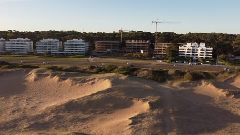 new houses and buildings along coastal and panoramic road near playa brava beach, punta del este city in uruguay