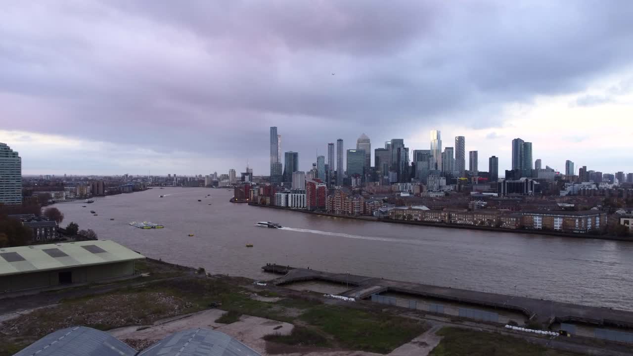 Aerial view of Canary Wharf with Uber Boat by Thames Clippers in London