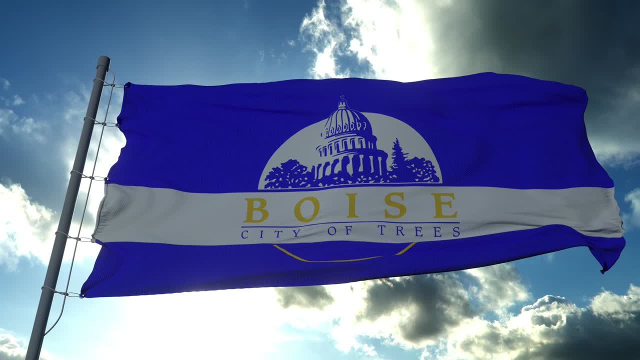 Boise city flag, city of Idaho in USA or United States of America, waving at wind in blue sky