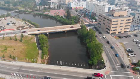 4K-Drone-Video-of-the-Cushman-Street-Bridge-over-the-Chena-River-in-Downtown-Fairbanks,-Alaska-during-Summer-Day