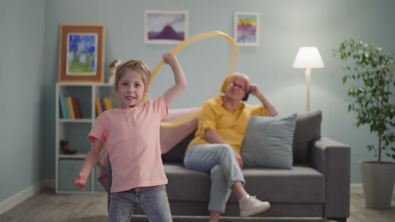 Pretty girl turns hula hoop nanny listen to audiobook