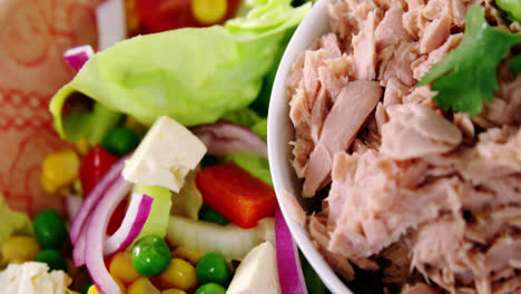 raw meat and vegetables in bowl