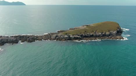 Orbiting-around-La-Ballena-de-OriÃ±Ã³n,-rock-formation-Island-in-Cantabria