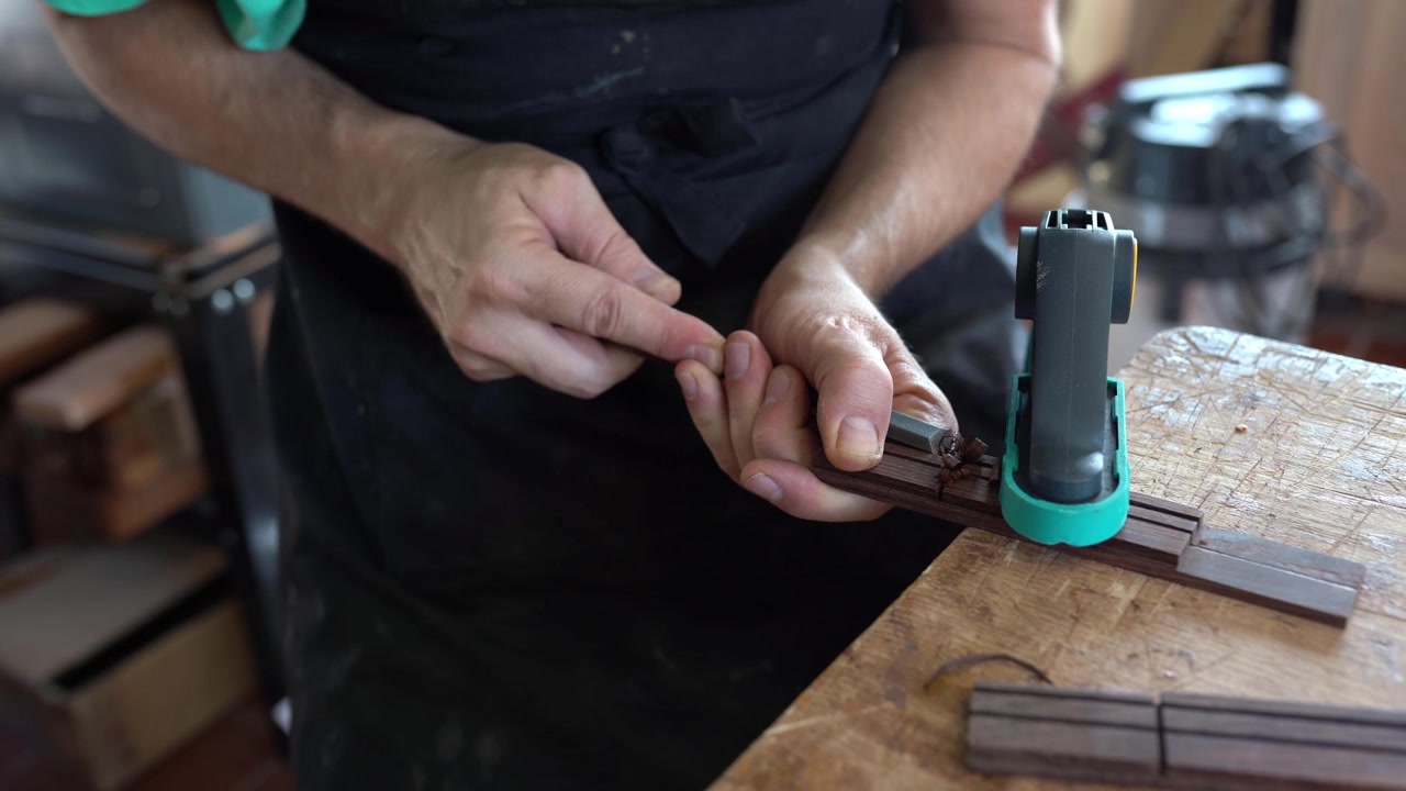 Spanish guitar maker or luthier working on a flamenco guitar