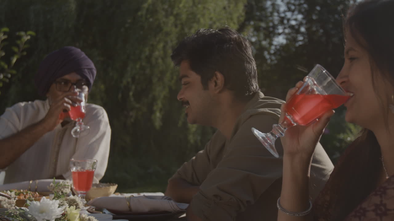 Family and Friends Enjoying Drinks Outdoors