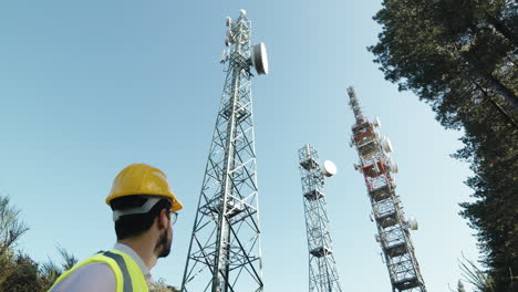 engineer looking at 5g antennas