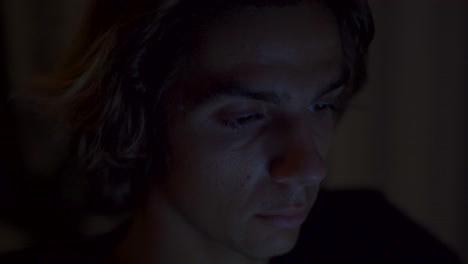 Eye close up of someone working on a computer by night, Timelapse