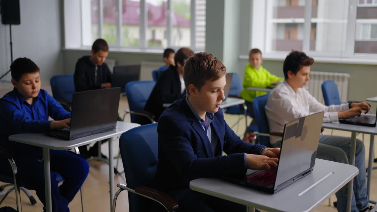Students in a Classroom Using Laptops